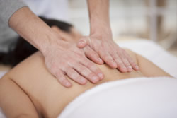Massage therapist giving Swedish massage for relaxation